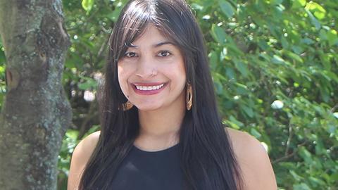 a person outside, smiling at the camera