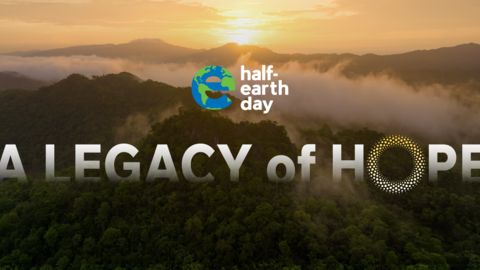 misty sunrise mountain view with text, half-earth day A LEGACY OF HOPE
