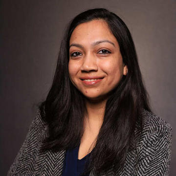 a person smiling at the camera