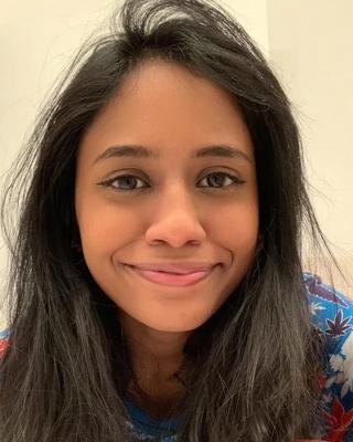 a person smiling at the camera