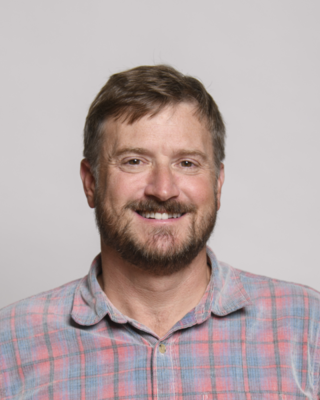 a person smiling at the camera