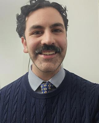 a person smiling at the camera
