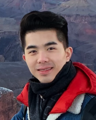 a person in front of a canyon