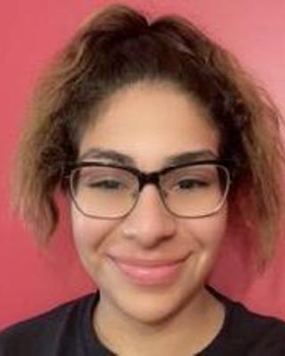 a person smiling at the camera