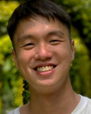 a person outside, smiling at the camera