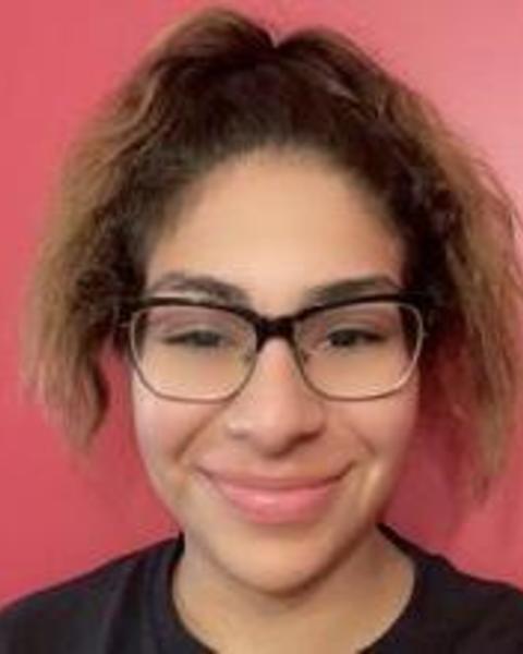 a person smiling at the camera