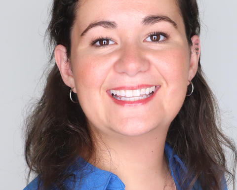 a person smiling at the camera