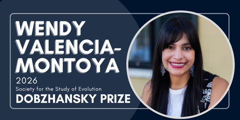 Rectangular dark blue graphic announcing an award. On the left, large white text reads “Wendy Valencia-Montoya” and below in smaller text “2026 Society for the Study of Evolution Dobzhansky Prize.” On the right is a circular photo of a smiling person with long straight dark hair and bangs, wearing dangling earrings and a black patterned vest over a white top, against a blurred indoor–outdoor background.